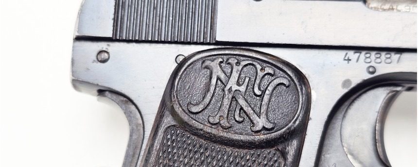 FN grip medallion and serial number 478887